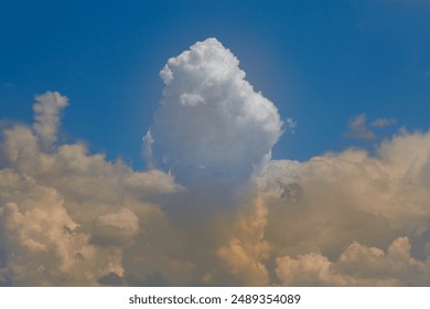 Big cloud looks like a portion of ice cream in a blue sky, fancy clouds in sunlight in a blue sky 
