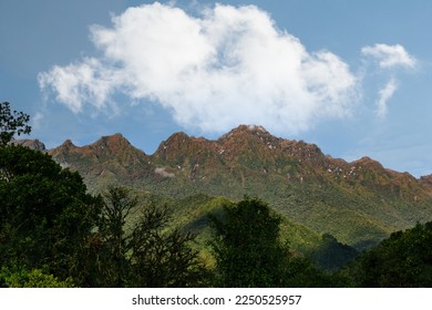 big cloud on top of Faraglioni mountains. Cali, Colombia.