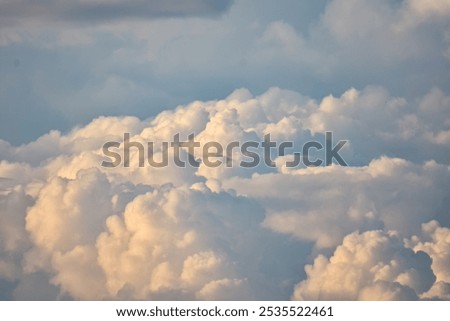 Big clouds in the sky gather together to form rain clouds.