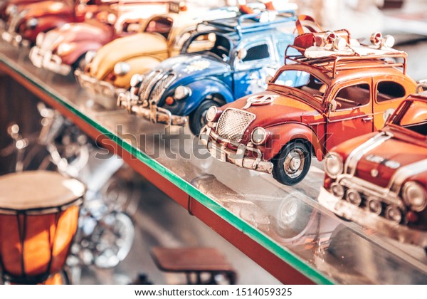 Big collection of retro car models on the\
shelf. Miniatures of colorful vintage vehicles in the shop. Turkey,\
Istanbul, 2019-08-18.