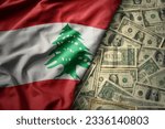 big colorful waving national flag of lebanon on a american dollar money background. finance concept