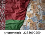 big colorful waving national flag of belarus on a euro money background. finance concept