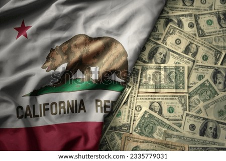 big colorful waving national flag of california state on a american dollar money background. finance concept