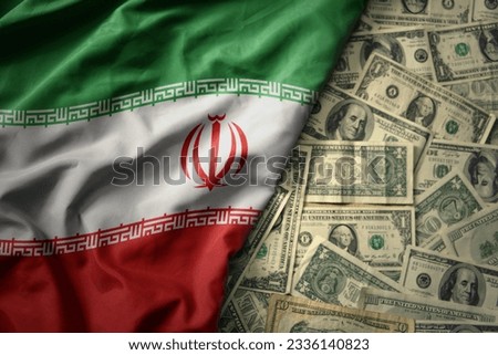big colorful waving national flag of iran on a american dollar money background. finance concept