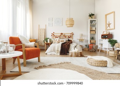 Big Comfy Orange Chair In A Bright Spacious Bedroom