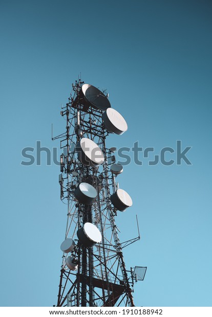 A big communication tower with a lot of GSM and\
internet antennas
