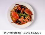 BIG CRAB CIOPPINO CRAB WOKKIN in a dish top view on grey background singapore food