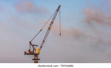 Big Crane In Morning Sky. Only One Crane And Space For Copy. The Sky Is Full Of Colors.