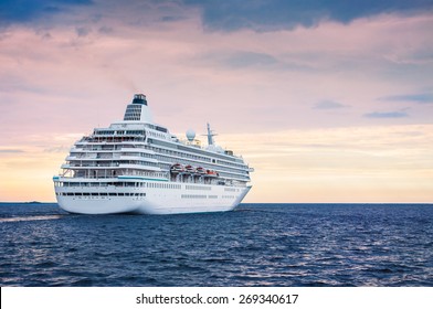 Big Cruise Ship In The Sea At Sunset. Beautiful Seascape