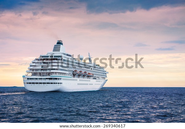 Big\
cruise ship in the sea at sunset. Beautiful\
seascape