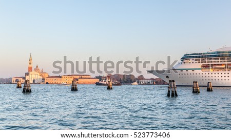 Big cruise ship with tourists leaving the city of Venice Italy  in the evening
