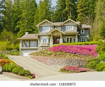 Big Custom Made Luxury House On The Rocky Slope With Nicely Landscaped Front Yard In The Suburbs Of North Vancouver, Canada.