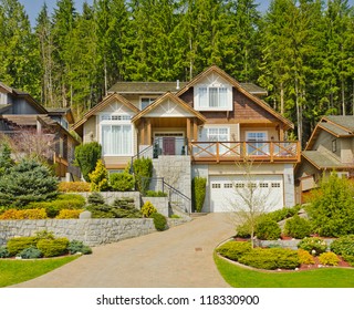 Big Custom Made Luxury House On The Rocky Slope With Nicely Landscaped Front Yard In The Suburbs Of North Vancouver, Canada.