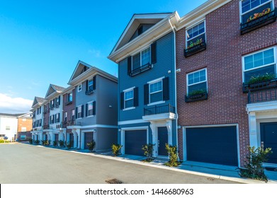 Big custom made luxury house, condo, townhouse with nicely landscaped and trimmed front yard and driveway to garage. - Shutterstock ID 1446680963
