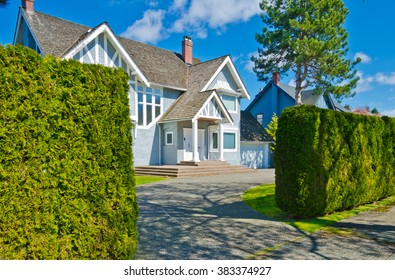 Big Custom Made Luxury House With Nicely Trimmed And Landscaped Front Yard In The Suburbs Of Vancouver, Canada.