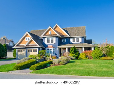 Big Custom Made Luxury House With Nicely Trimmed And Landscaped Front Yard In The Suburb Of Vancouver, Canada.