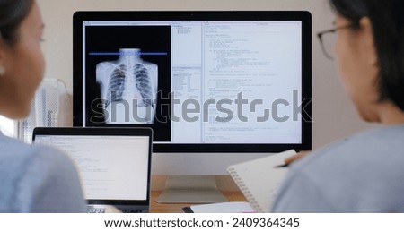 Big data AI coding screen for asian future health care smart tech IT solution. Asia team woman people code analyst job work on science project Lung X-ray scanner medtech tools meeting talk at office.