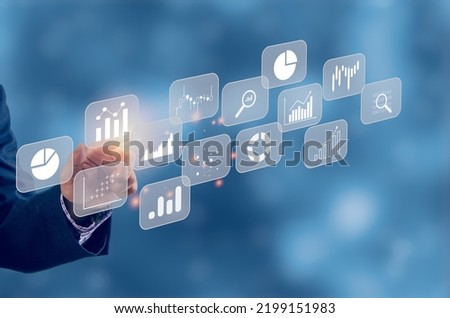 Big data analytics BI intelligence business concept with chart and graph icons on virtual screen interface and a businessman in background.