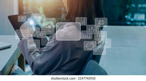 Big data analytics and business intelligence concept with chart and graph icons on a digital screen interface and a businessman hand in background