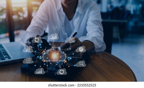 Big data analytics and business intelligence concept with chart and graph icons on a digital screen interface and a businessman in background