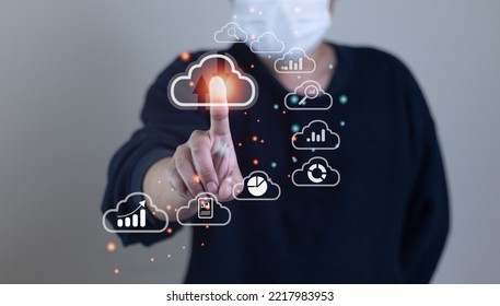 Big data analytics and business intelligence with chart and graph icons on digital screen interface and business man in background.