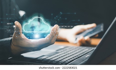 Big data analytics and business intelligence concept. Chart and graph icons on a digital screen interface in hand of businessman. 