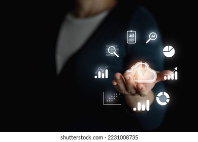 Big data analytics and business intelligence concept with chart and graph icons on a digital screen interface and a businessman in background