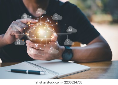 Big data analytics and business intelligence concept with chart and graph icons on a digital screen interface and a businessman in background