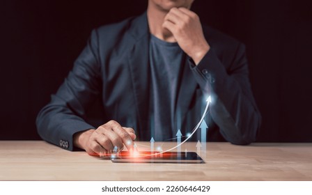 Big data analytics and business intelligence concept with chart and graph icons on a digital screen interface and a businessman in background