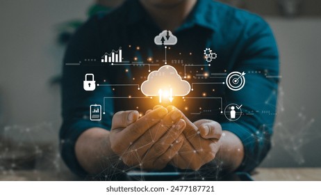 Big data analytics and business intelligence concept with chart and graph icons on a digital screen interface and a businessman in background. Collection of marketing information
