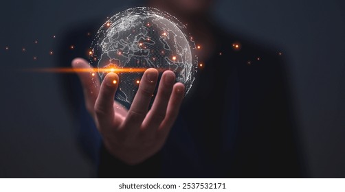 Big data analytics and business intelligence concept. Businessman holding Global network connection. World map point and line composition concept of global business.Digital link tech.
