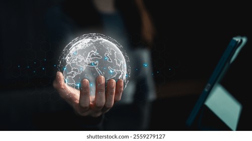 Big data analytics and business intelligence concept. Businessman holding Global network connection. World map point and line composition concept of global business.Digital link tech.