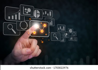 Big data analytics visualization technology with chart and graph icons on a digital screen interface and a businessman hand in background. business intelligence concept.