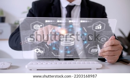 Big data and analytics visualization technology with scientist analyzing information structure on screen with machine learning to extract predictions for business, finance, internet of things