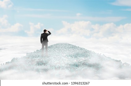 Big data highway, information analysis and restructuring concept, businessman looking for direction on the road of huge amount of green letters and numbers in the air, with sky clouds background. - Powered by Shutterstock