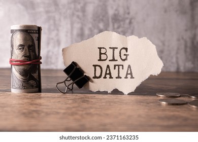 Big Data text saved in a notebook placed on a white keyboard. Concept in business.