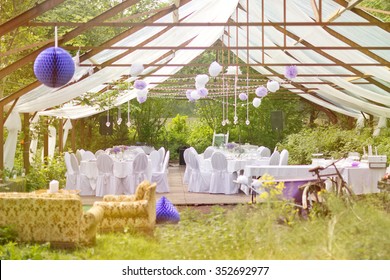The Big Day - outdoor wedding party in old greenhouse with white tables and fresh nature decorations