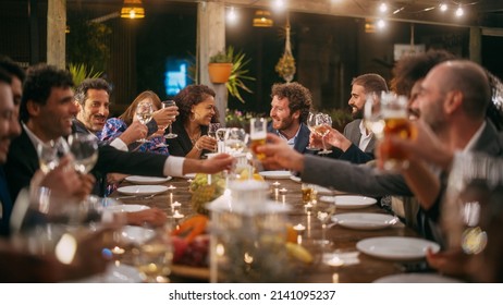 Big Dinner Party With A Small Crowd Of Multiethnic Diverse Friends Celebrating At A Restaurant. Beautiful Happy Hosts Propose A Toast And Raise Wine Glasses While Sitting At A Table In The Evening.