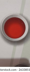 big dot image on red wall
