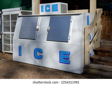 A big double door ice box outside of a store at a campground on a sunny day in wintertime - Shutterstock ID 2256311981
