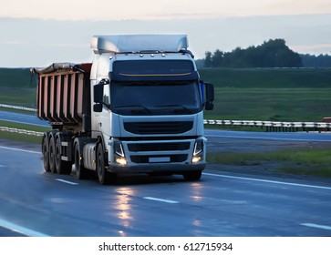 Big Dump Truck Goes On Country Highway