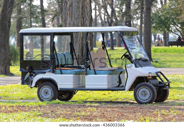 Big Electric Golf Cart in\
Park