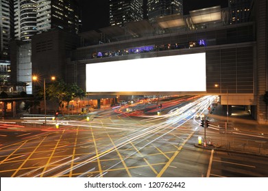 Big Empty Billboard At Night In City With Busy Traffic