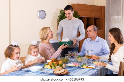 Big Family Celebrating Birthday At Festive Dinner