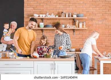 Big Family Cooking Together In Kitchen