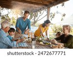 Big family, eating and lunch with food outdoor on patio with conversation, bonding or healthy meal in summer. Parents, grandparents and kids at dining table in home backyard for love, talk or dinner