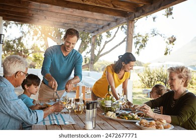 Big family, eating and lunch with food outdoor on patio with conversation, bonding or healthy meal in summer. Parents, grandparents and kids at dining table in home backyard for love, talk or dinner - Powered by Shutterstock