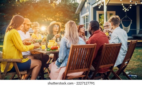 Big Family and Friends Celebrating Outside in a Backyard at Home. Diverse Group of Children, Adults and Old People Gathered at a Table, Having Fun, Eating Vegan Meals. - Powered by Shutterstock