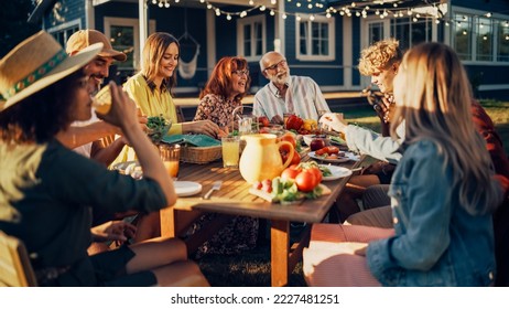 Big Family and Friends Celebrating Outside in a Backyard at Home. Diverse Group of Children, Adults and Old People Gathered at a Table, Kids Running and Having Fun. - Powered by Shutterstock