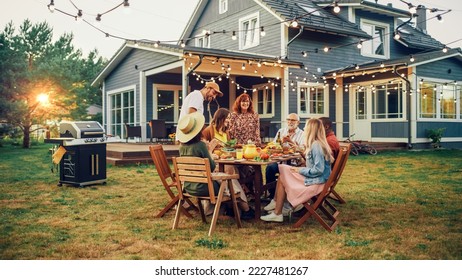 Big Family Garden Barbecue Party Celebration, Gathered Together at a Table with Relatives and Friends. Young and Senior People are Eating, Drinking, Passing Dishes, Joking and Having Fun. - Shutterstock ID 2227481267